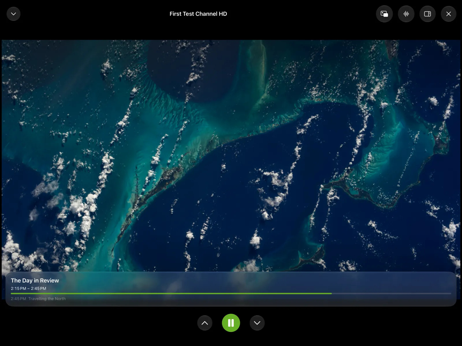 A channel playing on iPad with the current program as an overlay